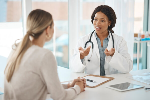 A doctor discussing treatment plans with a patient, highlighting the importance of innovative mental health solutions A doctor discussing treatment plans with a patient, highlighting the importance of innovative mental health solutions