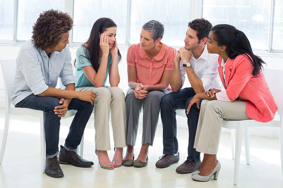 A supportive group therapy session, where individuals are collectively navigating the pathways to recovery from methamphetamine addiction
