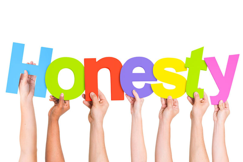 Diverse people holding up letters to spell honesty concept image for honesty in recovery.