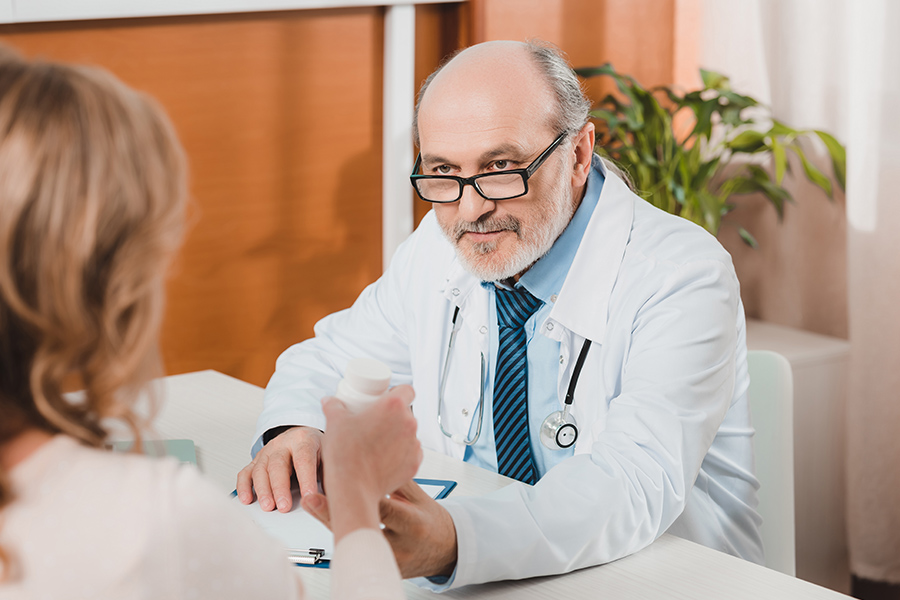 Doctor handing medication to patient concept image for what is drug detox