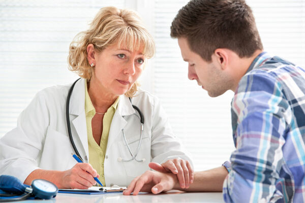 Doctor prescribing medication to patient concept image for medication assisted treatment.