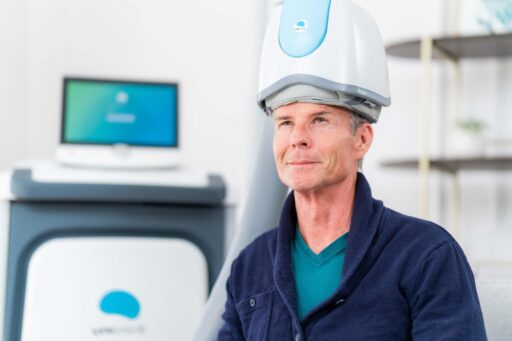 TMS Treatment for Cognitive health man sitting getting TMS treatment