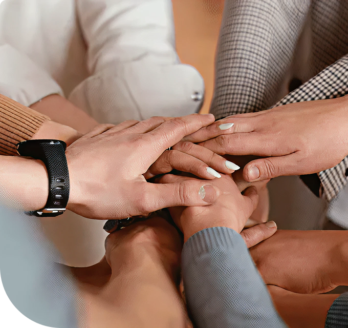 hands all together in center of circle