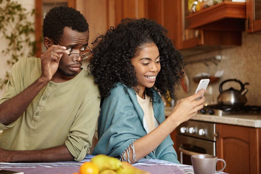 Reading a partner’s text concept image for emotional abuse and PTSD Reading a partner's text concept image for emotional abuse and PTSD
