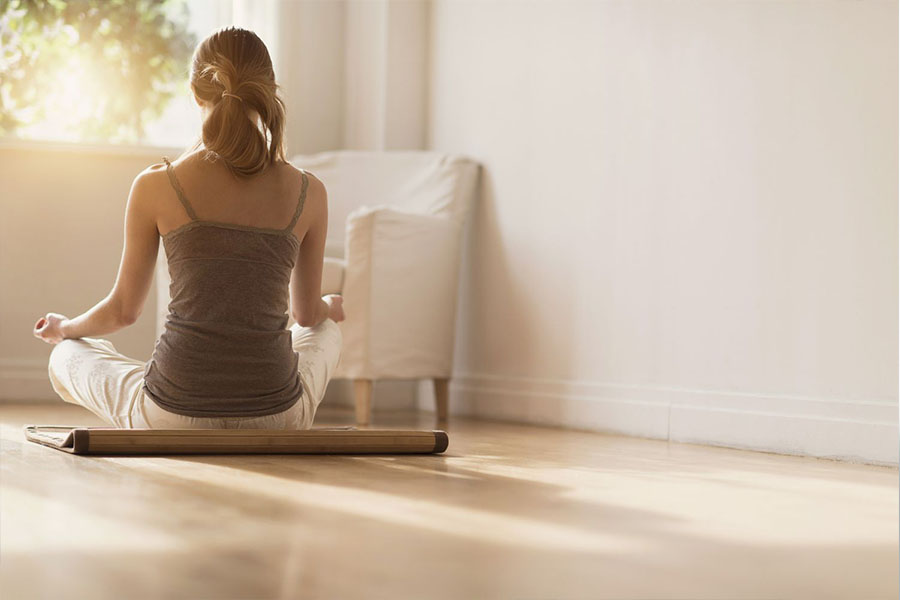 Woman practicing mindfulness and meditation at home – Promoting healing and resilience after childhood trauma for better mental health. Woman practicing mindfulness and meditation at home - Promoting healing and resilience after childhood trauma for better mental health.