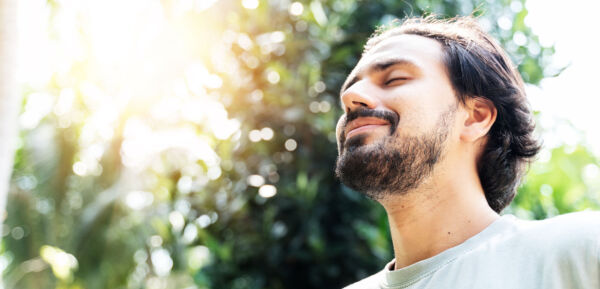 Young man free from depression after a successful transcranial magnetic stimulation. Common Self-Care Activities for addiction treatment