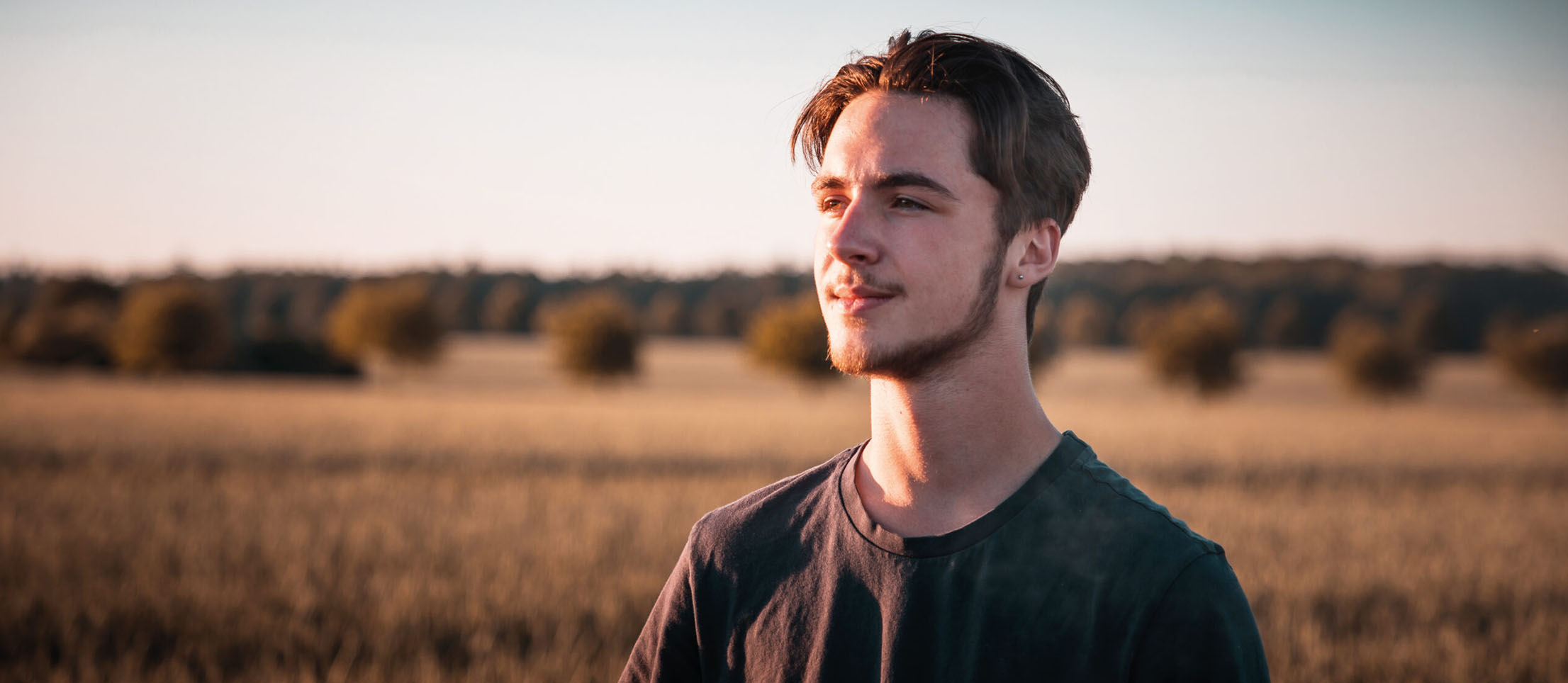 Young man looking at the horizon. Young man looking at the horizon. Background image