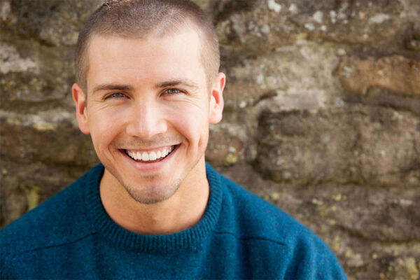 Young man smiling concept image for recovery from depression